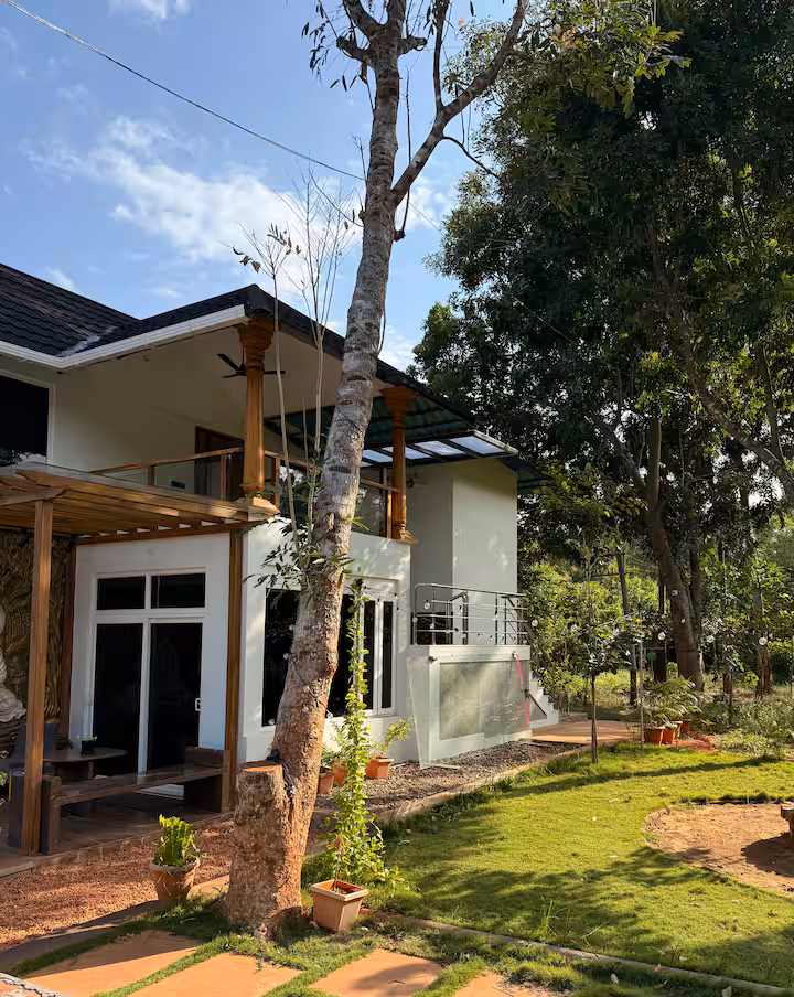Aura Bliss Villa — Private pool surrounded by tropical greenery in Auroville